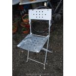 A galvanised folding chair