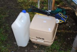 A new Porta Potty, water carrier, with 2 stools.