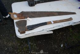 A 1900 E.C. Atkins Indianapolis 3' 6" cross cut saw and an axe.