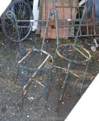 A pair of wrought iron chairs,