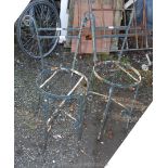 A pair of wrought iron chairs,