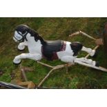 A metal sprung rocking horse.