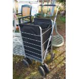 A square 4 wheeled fold up shopper