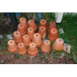 Sixteen terracotta plant pots