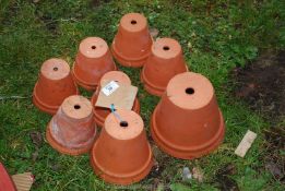 Eight various sized terracotta pots
