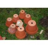 Eight various sized terracotta pots