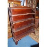 A circa 1900 Mahogany floor standing Bookshelves, the base with shaped bracket feet,