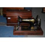 An old Singer Sewing Machine no. S 2242663 (with keys).