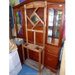 A light Oak Hall stand having a square bevelled mirror,