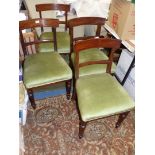 A set of four dining chairs all stamped CHAN.