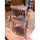 A 19th century Rosewood bow-fronted corner what-not having mirrored twist supports to the three