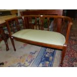 An attractive Mahogany framed Edwardian two seater Salon Sofa by Warings (Waring & Gillows,