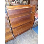 A circa 1900 Mahogany waterfall Bookcase having cross-banded and lightwood strung decoration and