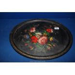 A Toleware tin Tray in the manner of Pontypool with floral detail to centre.