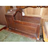 An appealing antique Oak rocking Cradle of good colour and with raised and fielded panels,