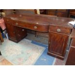 A substantial circa 1900 cross-banded Mahogany/Walnut sideboard having a central recess with a bow