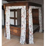 An Oak four poster Bed, 59 5/8" wide x 77 3/4" high x 85 1/2" long approx.