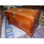 An Oriental Camphorwood blanket chest with carved details,