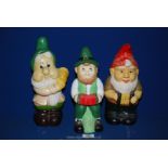 Three hand painted 20th c. ceramic garden gnomes, all approx 12" tall.