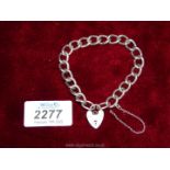 A large link solid silver bracelet with padlock fastening, each link marked.