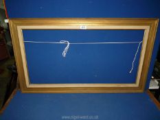 A gold painted wooden picture Frame, 37'' x 21 1/4'', aperture 31 3/4'' x 16 1/4''.