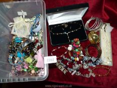 A quantity of costume jewellery to include; bangles, necklaces, bracelets of wooden beads, etc.