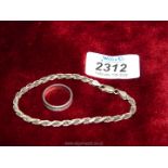 A 925 silver ring and rope twist bracelet marked 925 to the clasps.