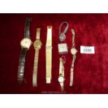 Several vintage wristwatches including; a gents Ingersoll with leather alligator Omega strap.