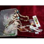 A quantity of costume jewellery including; shell and seed necklaces, glass beads, etc.
