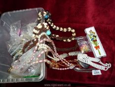 A quantity of costume jewellery including; shell and seed necklaces, glass beads, etc.