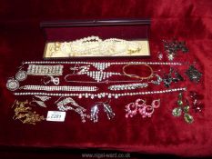 A quantity of costume jewellery to include; box of earrings, diamonte necklace, bracelets,