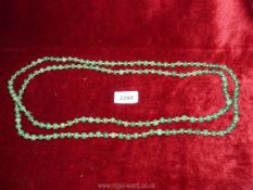 A long strand of Jade beads, 33 1/2'' long.