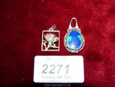 A silver and polished stone Art Nouveau style pendant stamped 925 plus a silver framed rose pendant