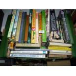 A box of gardening and wildlife books.