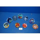 Nine glass paperweights to include millefiori, fish, various multicoloured,