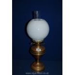 A brass oil lamp and white globe shade, 21 1/4".