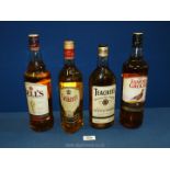 A sealed 1 litre bottle of Famous Grouse Whisky, sealed litre bottle of Bells Whisky,