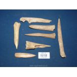 A collection of Neolilthic awls or pointed bone tools, in excavated condition.