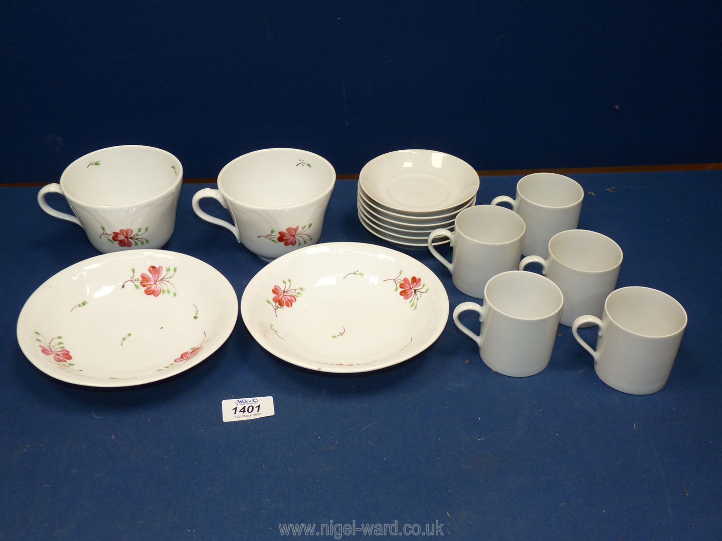 Two pretty hand painted breakfast cups and saucers and six white porcelain coffee cans and saucers.