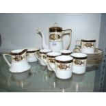 A Noritake six place setting 1930's coffee set in white cream gilt with black band,