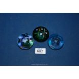 Three Caithness boxed paperweights to include " Moon crystal" and "Noughts and Crosses".