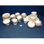 A Gladstone 'Laurel Time' part Teaset to include six cups, saucers and plates, jug and bowl,