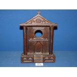 A Folk art carved sandstone watch stand, possibly Welsh, in the shape of a pillared chapel facade,