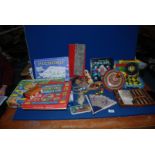 A box of vintage toys and games including Roulette, spinning top,skipping rope, backgammon etc.