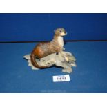 A Holland Studio Craft Otter, 6'' long x 4'' tall.