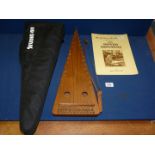 A cased bowed Psaltery by Lucy and Woolgrove and a music tutor (bow in case).