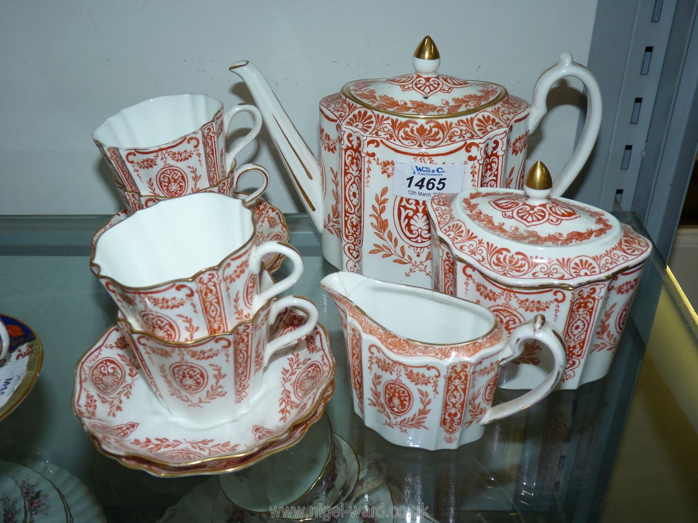 A Victorian Teaset in red and cream by Wedgwood including teapot, four cups,