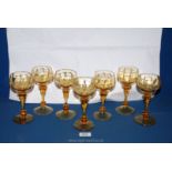 A set of seven fine Venetian amber coloured glass hock glasses.