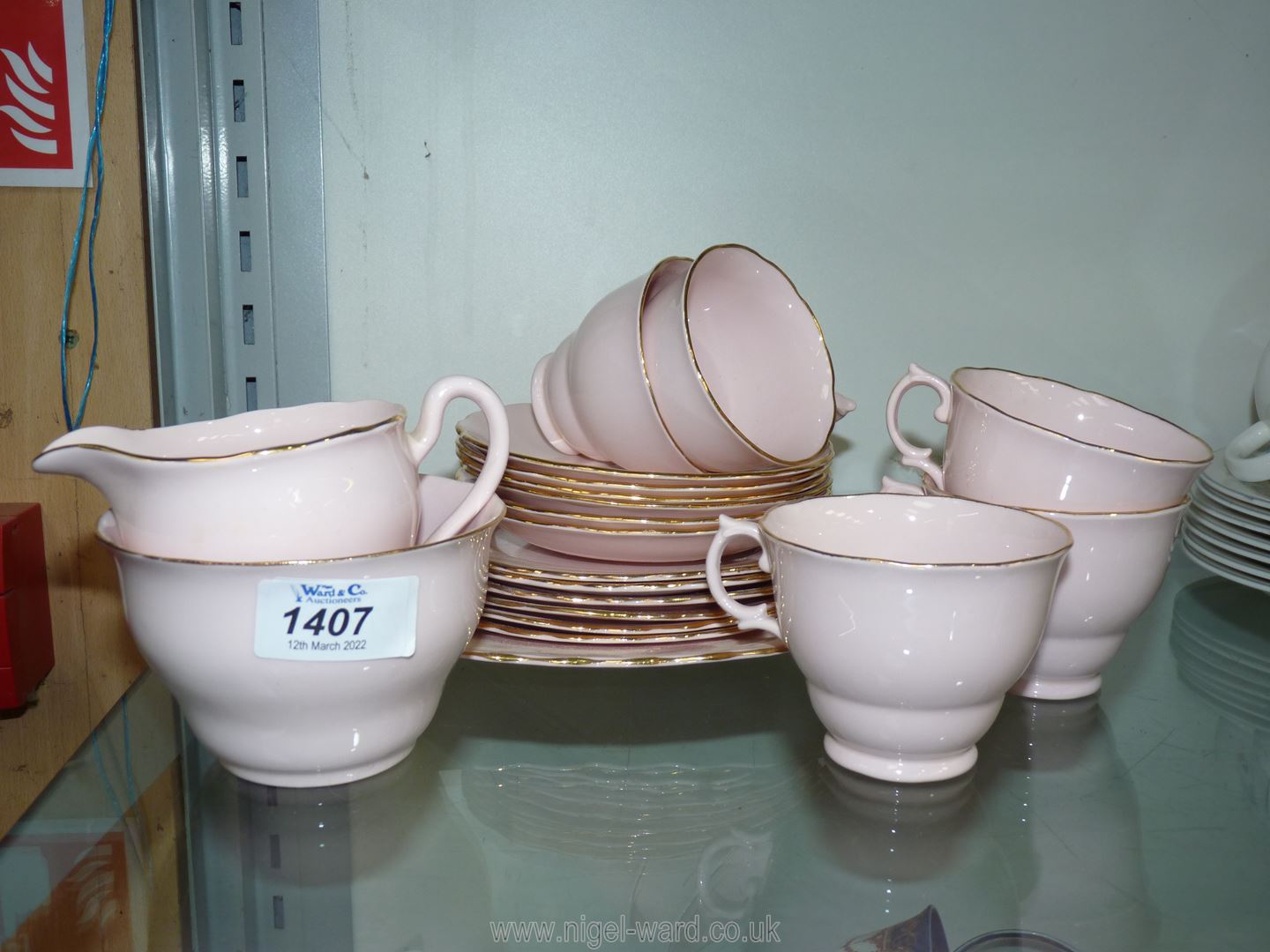 A Pink Vogue bone china part Teaset comprising five cups and six saucers, six tea plates,