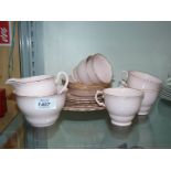 A Pink Vogue bone china part Teaset comprising five cups and six saucers, six tea plates,